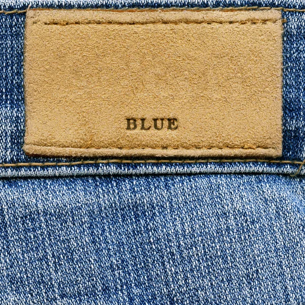 Etichetta con la scritta "BLUE" sul denim — Foto Stock
