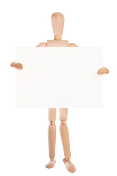 Wooden dummy showing up blank paper card — Stock Photo, Image