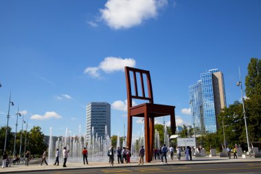 Group of tourist in the Broken Chair Monument, Geneve clipart