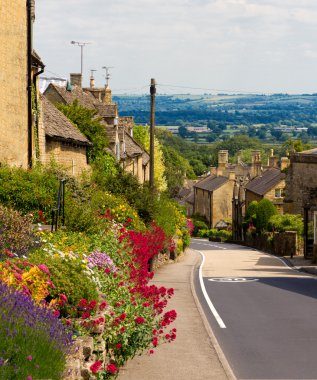 Cotswolds village Bourton-on-the-Hill with flowers, UK clipart