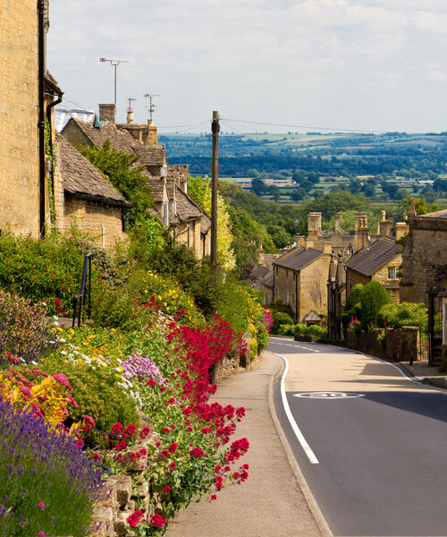 Cotswolds village Bourton-on-the-Hill with flowers, UK