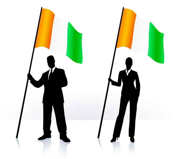 Business silhouettes with waving flag of Ireland — Stock Vector