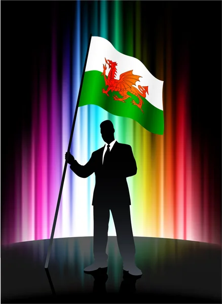 Wales Flag with Businessman on Abstract Spectrum Background — Stock Vector