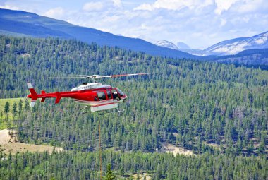 Rescue helicopter in mountains clipart
