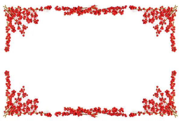 Рождественская граница с красными ягодами — стоковое фото