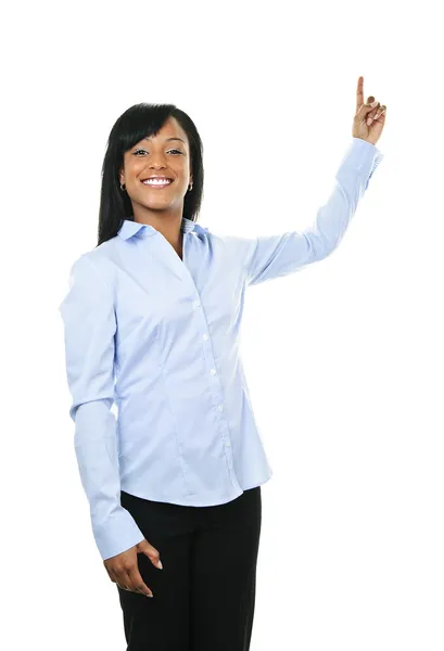 Mujer joven sonriente señalando hacia arriba — Foto de Stock
