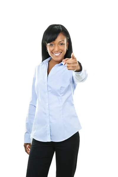 Smiling young woman pointing finger — Stock Photo, Image