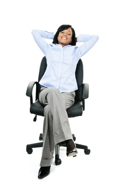 Zrelaksowany kobieta siedzi na krzesło — Zdjęcie stockowe
