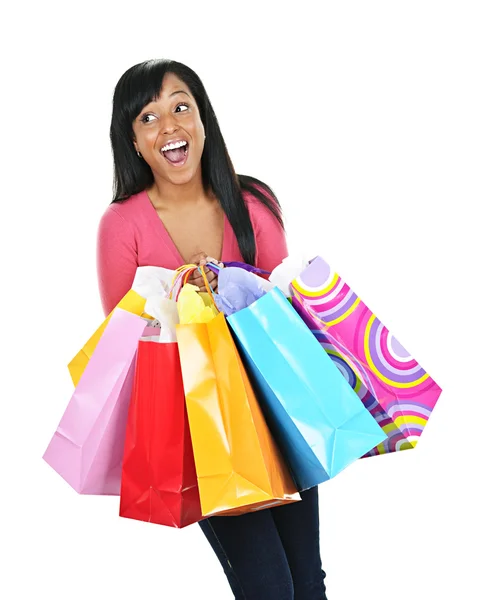 Jovem mulher negra excitada com sacos de compras — Fotografia de Stock
