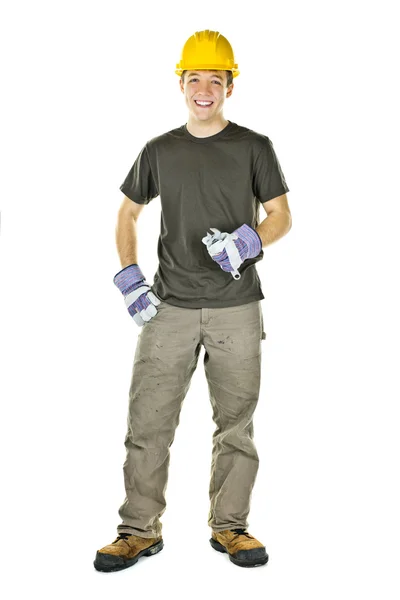 Jovem trabalhador da construção sorrindo — Fotografia de Stock