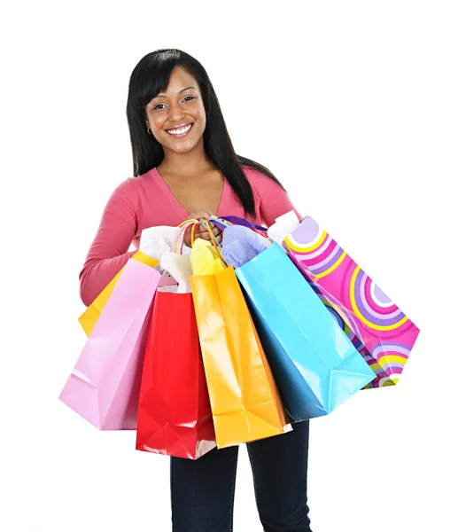 Glückliche junge schwarze Frau mit Einkaufstaschen Stockbild