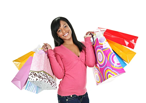 Glückliche junge schwarze Frau mit Einkaufstaschen Stockbild