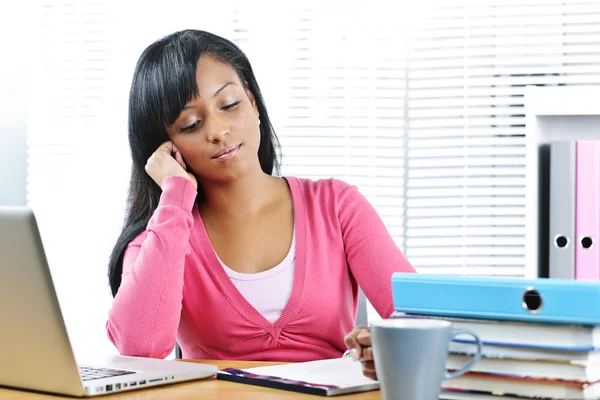 Thoughtful female student studying Royalty Free Stock Images