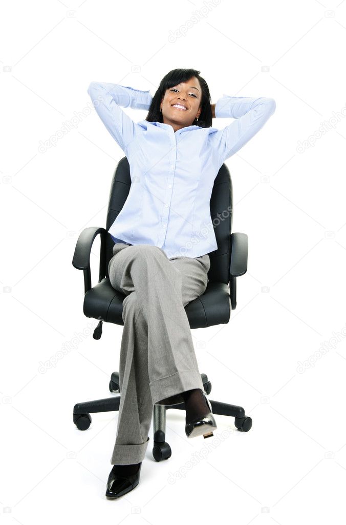 Relaxed businesswoman sitting on office chair