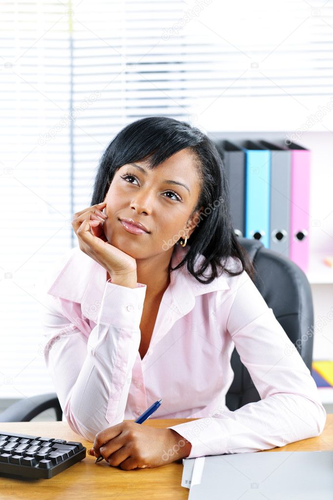 Black businesswoman at desk in office