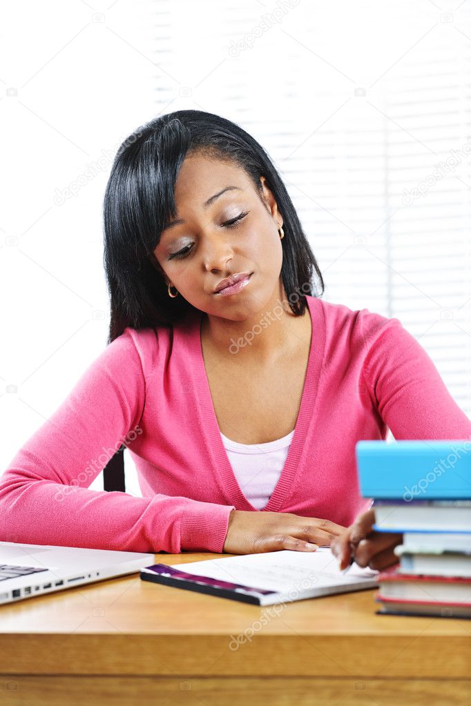 Unhappy female student studying
