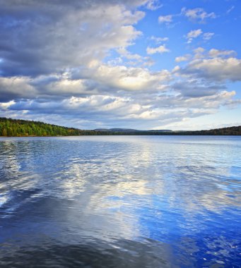 Lake reflecting sky clipart