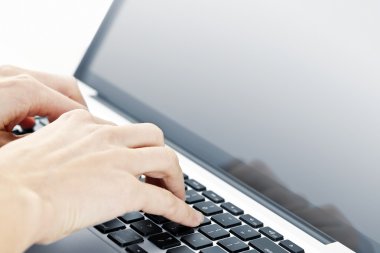 Hands typing on laptop keyboard clipart