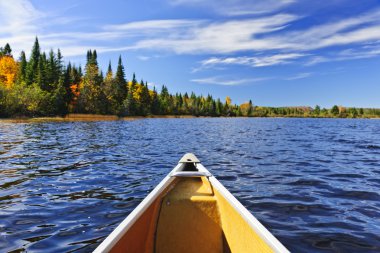 Canoe bow on lake clipart