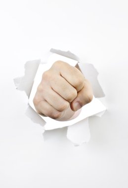 Fist punching through hole in paper clipart