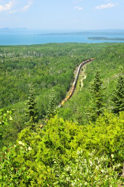 Train going through northern Ontario Canada clipart