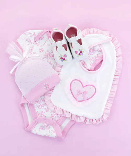 Růžové dětské oblečení dětská dívku — Stock fotografie