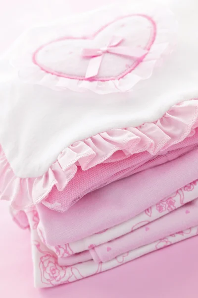 Růžové dětské oblečení dětská dívku — Stock fotografie