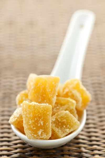 Candied ginger pieces in spoon — Stock Photo, Image
