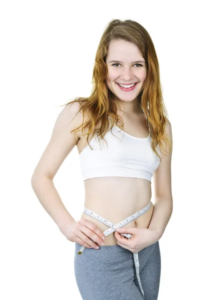 Gezond meisje meten van haar taille — Stockfoto