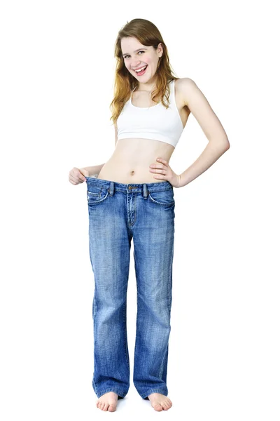 Šťastná dívka v džínách po hubnutí — Stock fotografie
