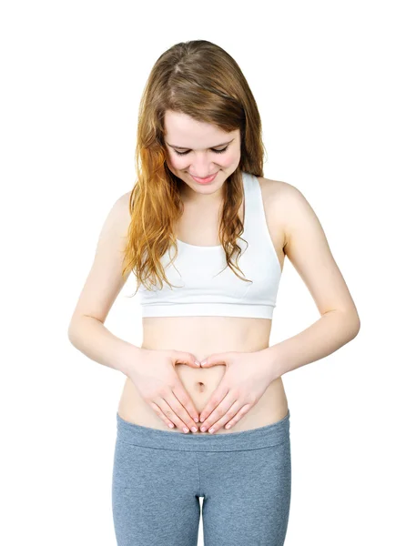 Teenage girl with hands on tummy — Stock Photo, Image