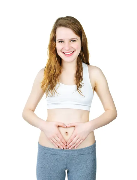 Smiling girl with hands on tummy — Stock Photo, Image