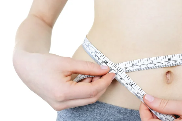 Healthy girl measuring her waist — Stock Photo, Image