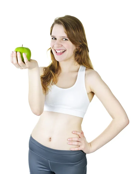 Молодая улыбающаяся девушка держит яблоко — стоковое фото