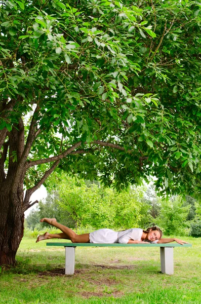 stock image Young beauty in park