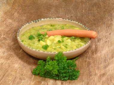 Pea soup with sausage clipart