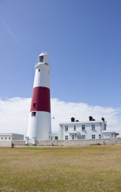 Portland bill lighthouse with clear blue sky clipart
