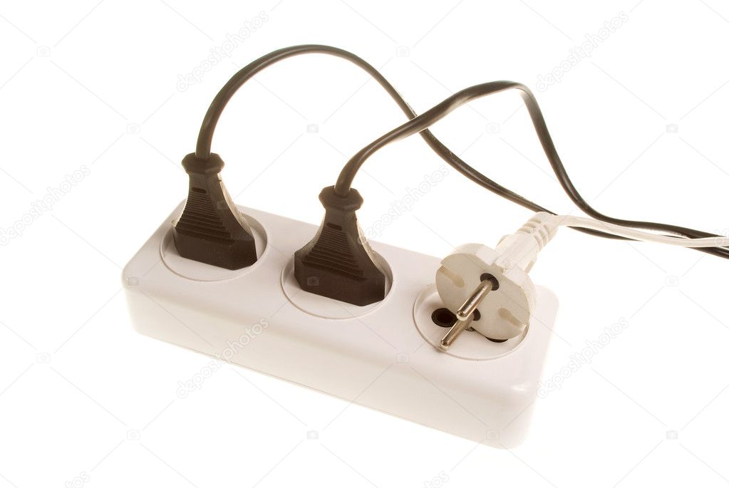 Three white and black electrical plugs into the outlet