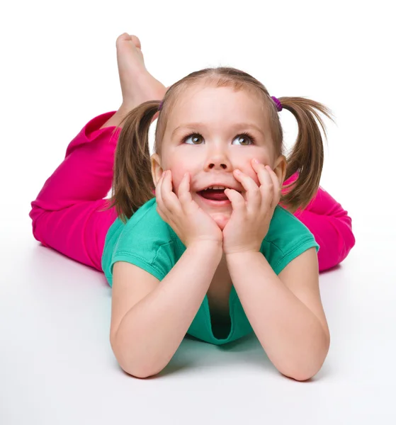 Portrait of a cute little girl laying on floor — Stock Photo, Image
