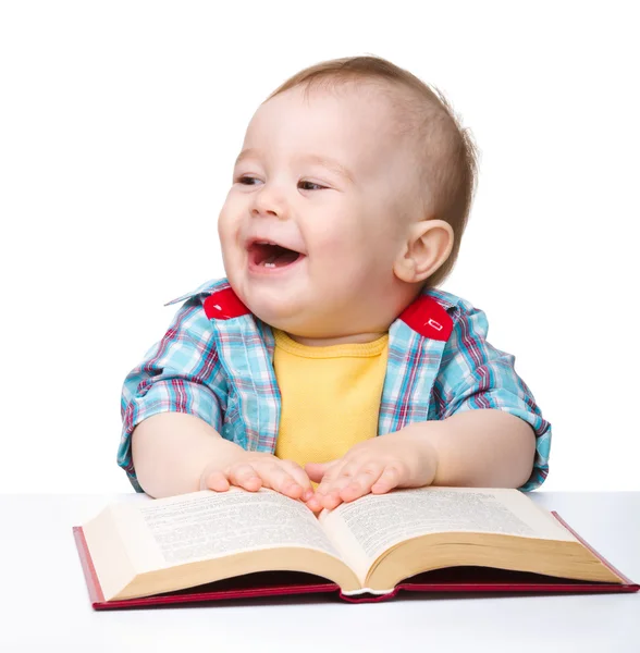 Little child play with book Stock Image