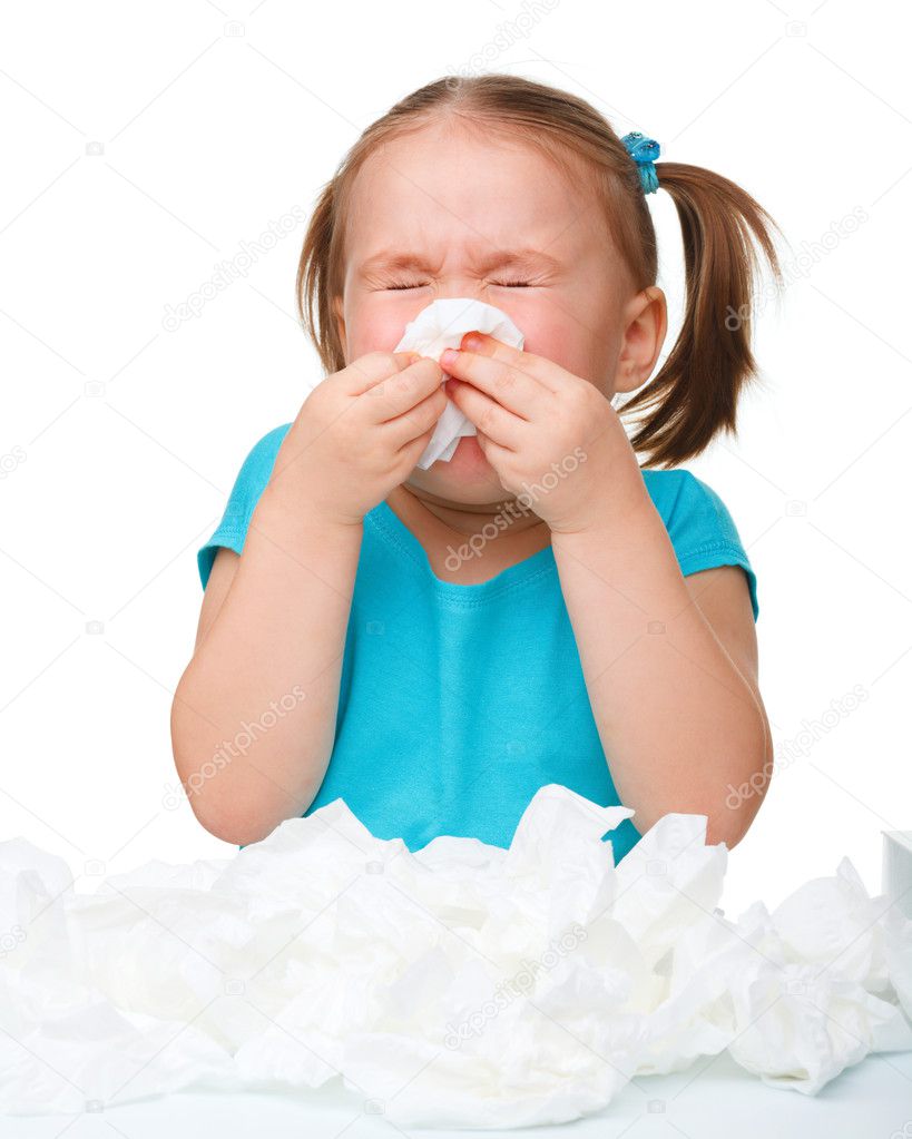 Little girl blows her nose