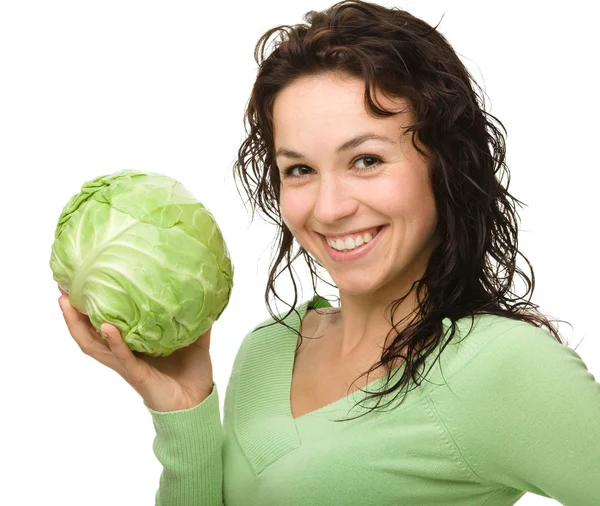 Beautiful young girl with green cabbage — Stock Photo, Image