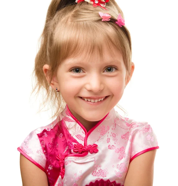 Süßes kleines Mädchen im rosa Kleid — Stockfoto