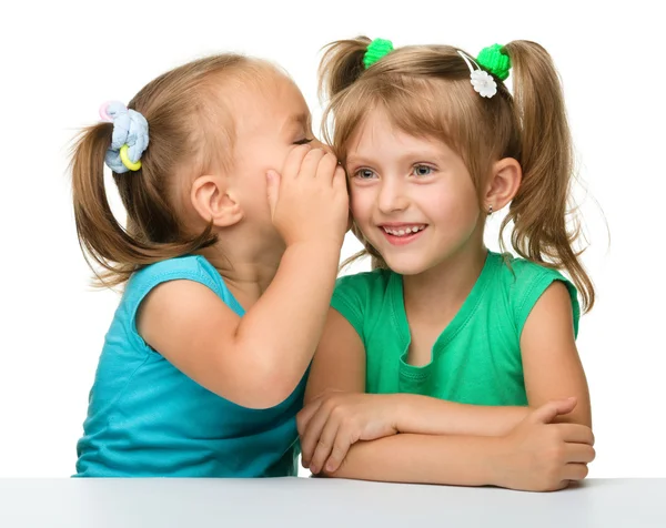 Two little girls are chatting Stock Image