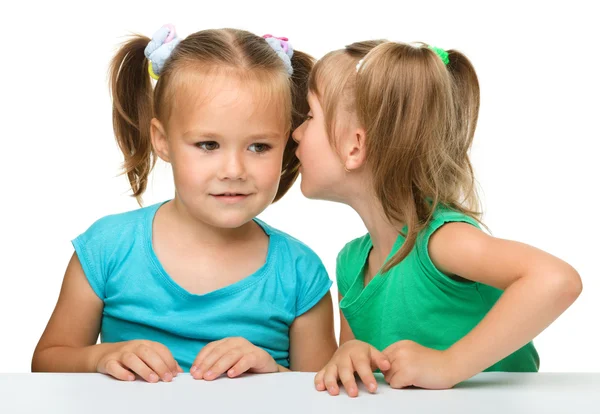 Two little girls are chatting Stock Photo