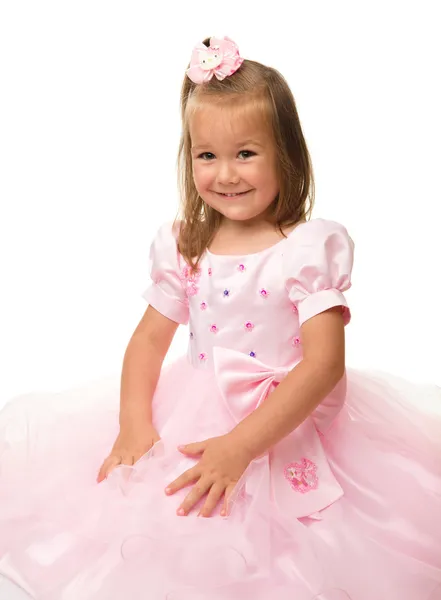 Schattig klein meisje in roze jurk — Stockfoto
