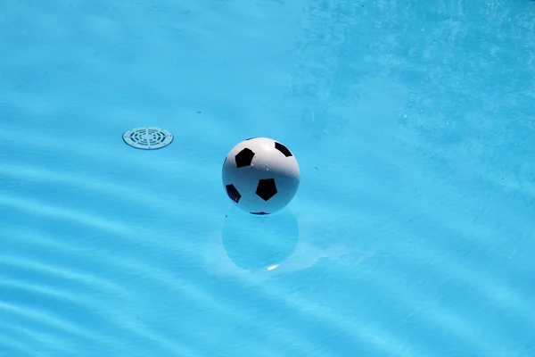 Soccer ball in the pool — Stock Photo, Image