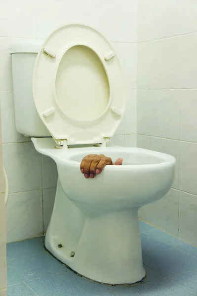 Hand in toilet — Stock Photo, Image