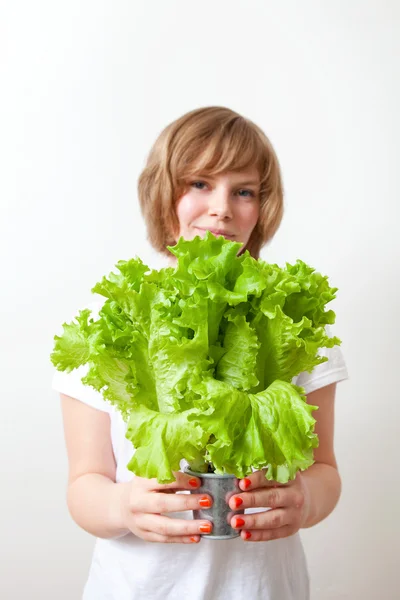 Young woman holding lettuce — Stock Photo, Image