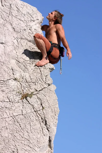 Happy climber near the top of the wall — Stock Photo, Image